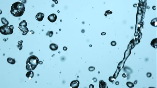 Abstract Water Droplets and Streams on Blue Background
