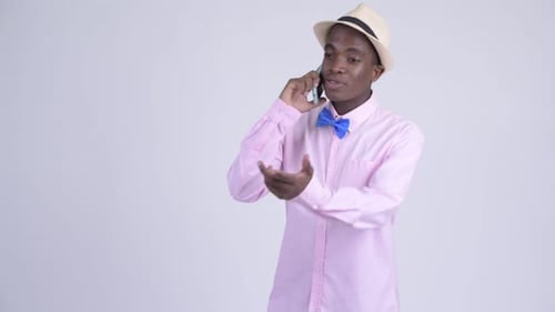 Young Happy African Tourist Man Talking on the Phone
