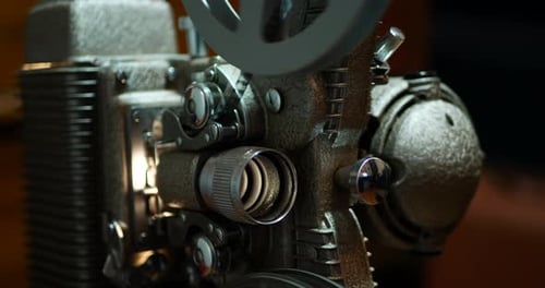 Close up of an 8mm projector showing a movie.