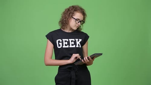 Teen Using Tablet with Green Screen Background