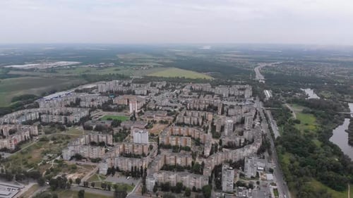 Aerial Panorama on City with Multi-Story Buildings Near Nature and River