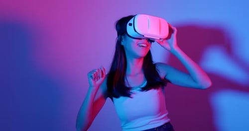 Woman Using VR Headset in a Studio