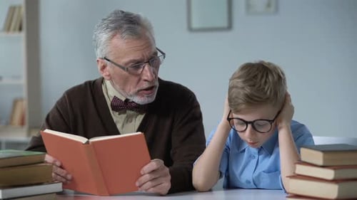 Grandfather Reading Aloud Book, Little Boy Looks Bored, Generation Gap Problem