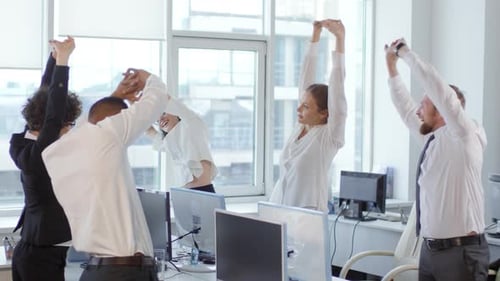 Office Workers Stretching at Their Desks