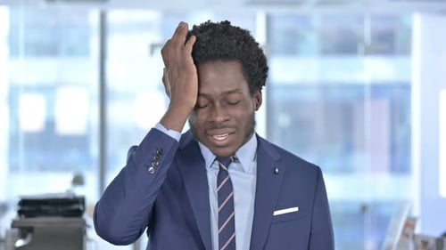 Stressed Businessman in Modern Office Workplace