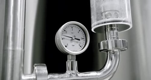 Pressure Gauge Attached to Industrial Pipes