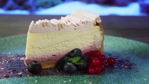Slice of Creamy Cheesecake with Berries on Plate