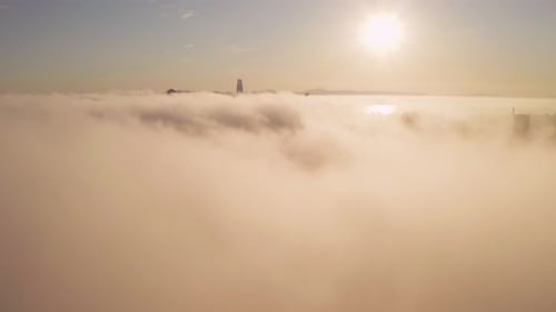 Sunrise Over Foggy City Aerial
