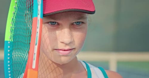 Teen Girl with Tennis Racket Close-Up