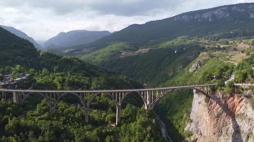 Aerial View of Long Iron Bridge Over a Mountain Gorge