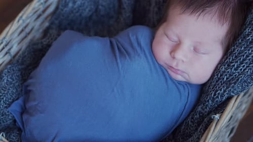 Close-up portrait of a young baby who has recently been born.