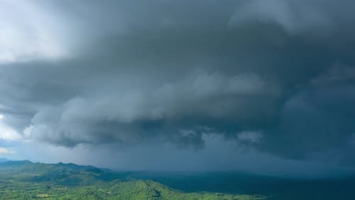 Aerial view Summer Thunderstorm and Black clouds moved over the mountains.