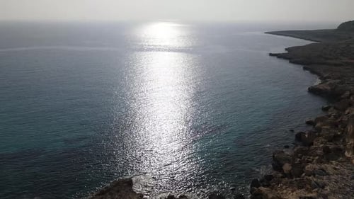 Flight of the camera over the sea. Evening light at sea. Sunset at the sea. Mediterranean. Close-up.