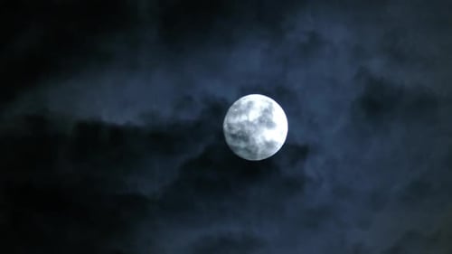 Timelapse with Full Moon Moving Between Clouds