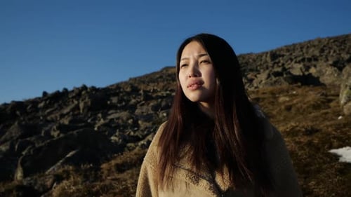 Young Woman Exploring Rugged Wilderness Environment
