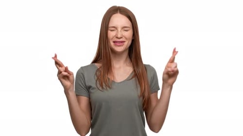 Hopeful Woman Crossing Fingers, White Background