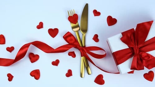 Romantic Setting with Gold Cutlery and Hearts