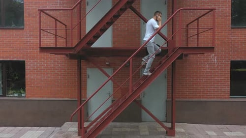 Businessman Climbing Up the Stairs of a Business Centre