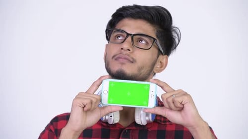 Young Adult Holding Green Screen Cell Phone