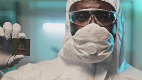Portrait of African American Lab Worker Holding Chip