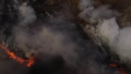 Aerial View of Burning Field with Smoke