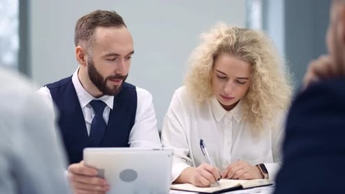 Business Colleagues Collaborating During a Meeting