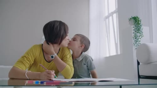 Mother and Son Drawing Together at Home