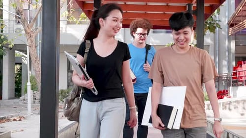 Education and student concept. Students walking and talking in university