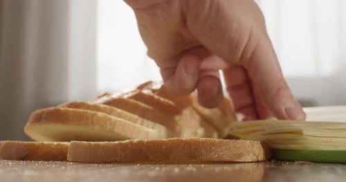 Making a Cheese Sandwich With Sliced Bread and Cheese