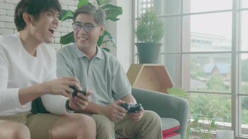 Generations Enjoying Video Games Together at Home
