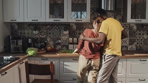 Couple Cooking Together in a Modern Kitchen