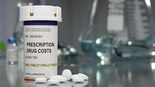 Prescription Drug Costs with Pills in Lab