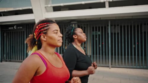 Two Women Running for Health and Fitness Together