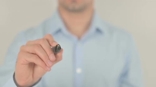 Man Writes the Word Payment on Transparent Surface