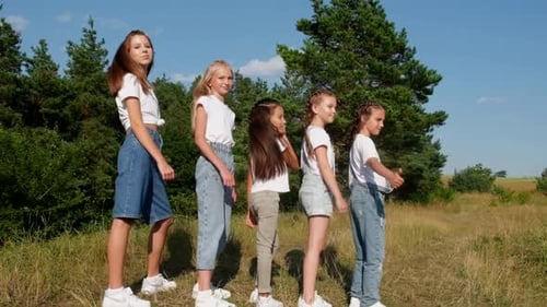 Girls Give Thumbs Up on Summer Day