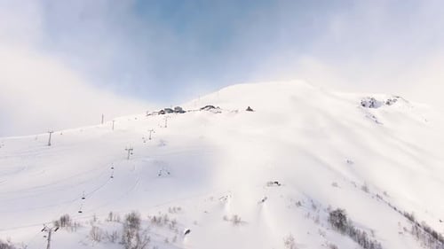 Ski Resort with Cable Car and Buildings Covered with Snow