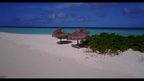 Aerial flying over landscape of luxury coast beach trip by blue green sea and white sand background