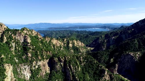 Aerial View of Mountain with Water Reservoir on the Background with Beautiful Blue Sky