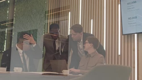 Multiethnic Marketing Team Working on Project in Office