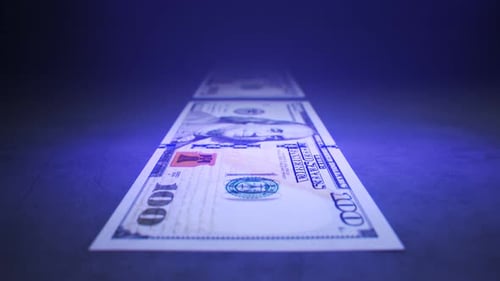 UV Light Scanning 100 Dollar Bills for Security