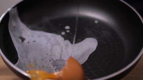Top View of a Broken Egg on the Kitchen Pan Floor with Wood Texture Close Up Loser Chef Drop Falls