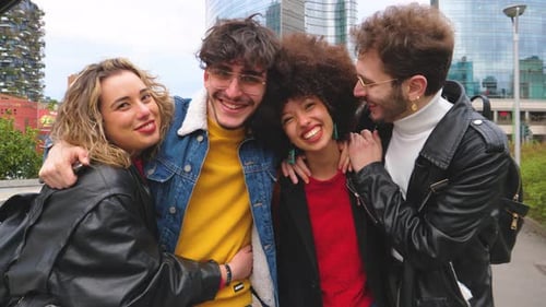 Smiling Friends Embrace in Urban City Setting