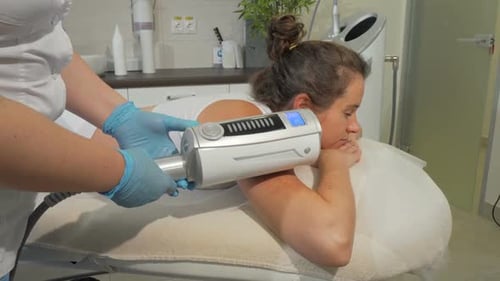 Woman Receives Massage in Medical Office