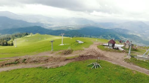 Aerial View Flight Over a Ski Lift in the Mountains in Summer, Tourist Mountain Lift From a Height