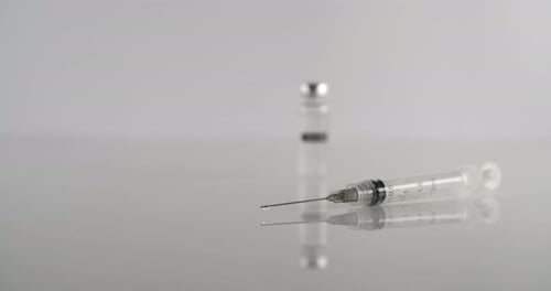 Hypodermic Needle and Vial of Medicine