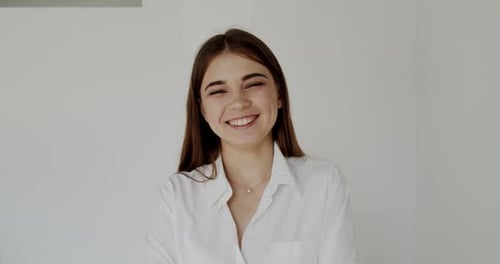 Smiling Young Adult Female Portrait in White Shirt