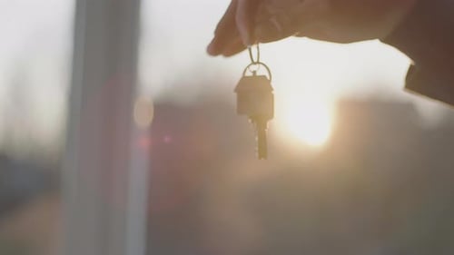 Man giving keys to a lady