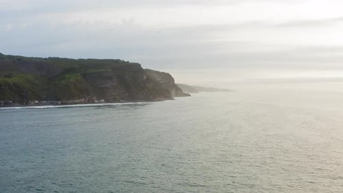 Aerial View of the Picturesque High Coastline Sharp Cliffs and Raging Sea
