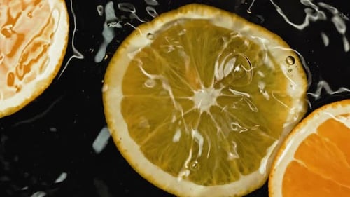 Die Orange fällt ins Wasser, Zeitlupe