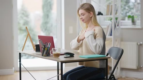 Woman Communicating in Sign Language During Video Call